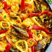 This Classic Spanish Paella rivals any restaurant paella! Sometimes nothing compares to good home cooking, and recipe by a beloved mother | https://cafedelites.com