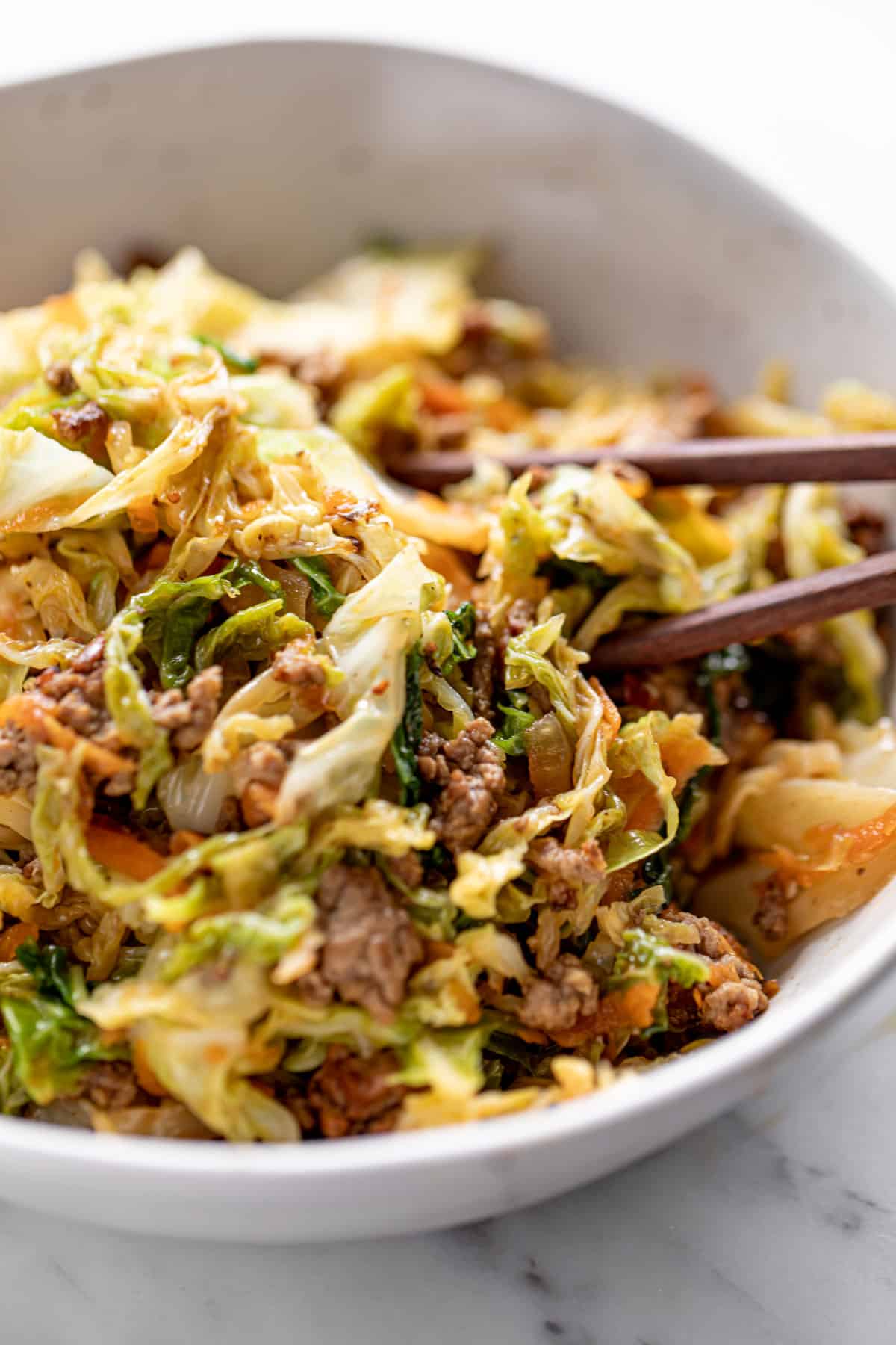 Ground Beef in a bowl with cabbage, served with chop sticks | cafedelites.com