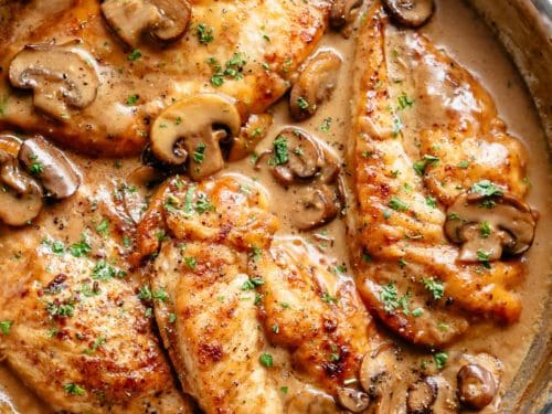 Chicken Marsala in a thick and creamy mushroom sauce rivals any restaurant! One of the most sought after dishes served in restaurants is super fast and easy to make in your very own kitchen! A flavourful chicken dinner with plenty of sauce to serve over your sides and an authentic Italian taste! | cafedelites.com