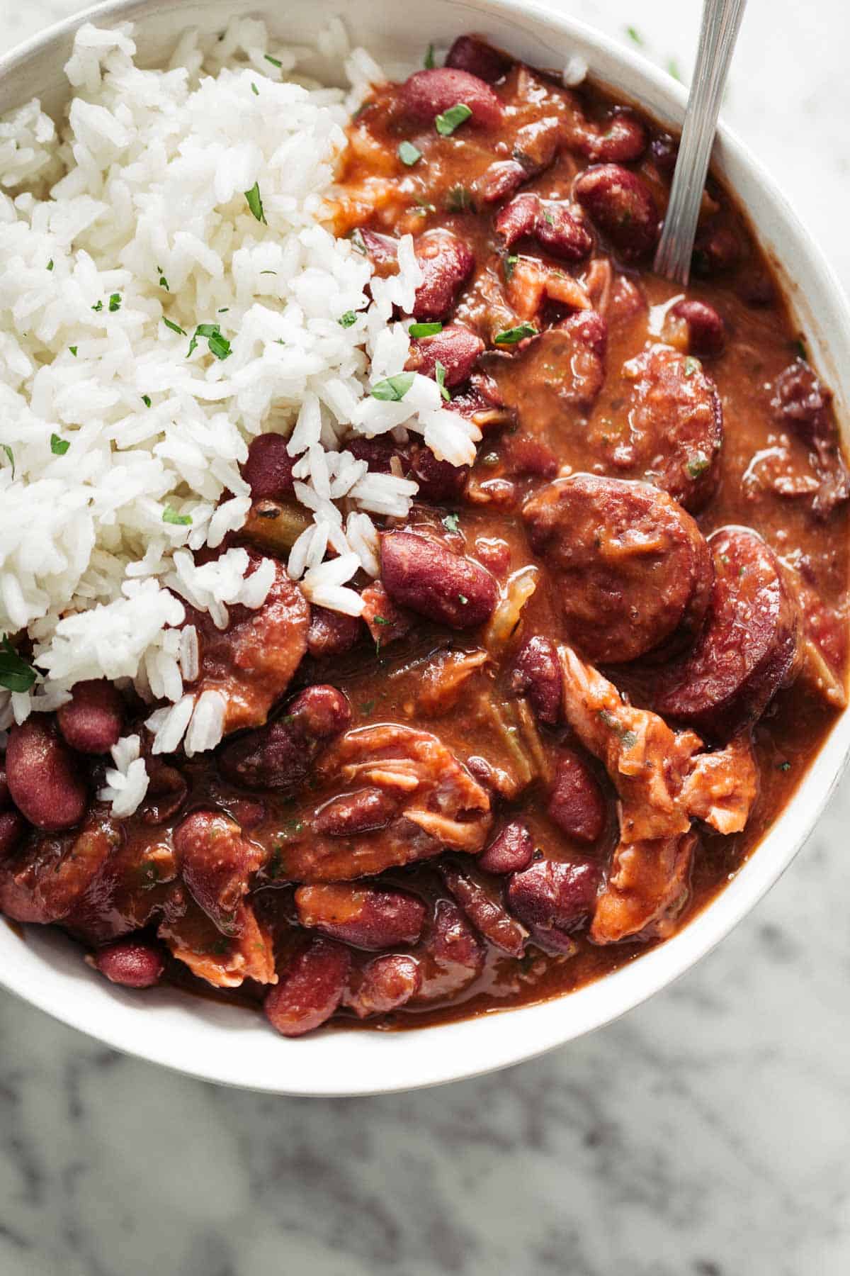 Red Beans and Rice with Andouille sausage and ham hock has so much flavour! Perfect for Mardi Gras right out of New Orleans with fresh cornbread | cafedelites.com