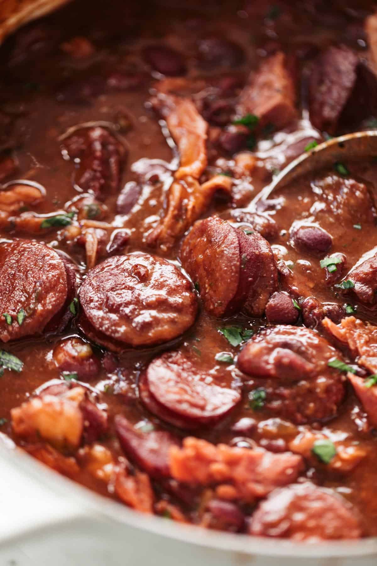 A pot of red beans for rice with andouille sausage and ham shanks or ham hocks | cafedelites.com
