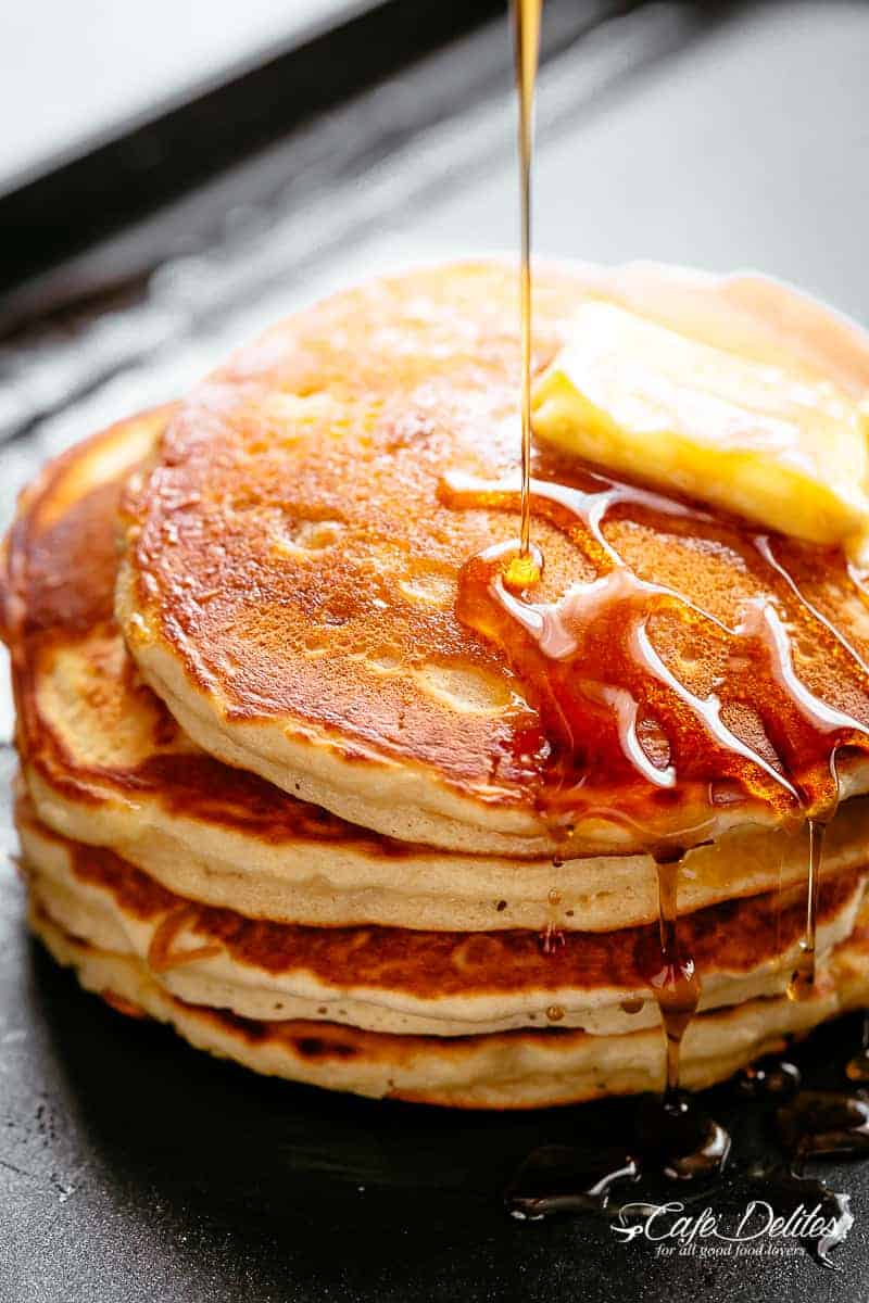 Buttermilk Pancakes are deliciously buttery and fluffy with golden, crisp edges and an irresistible buttermilk flavour. With some tips and tricks to help you get a steaming stack of incredible tasting pancakes, you can now quench your pancake craving whenever it hits with Buttermilk Pancakes. Light, soft and fluffy with the perfect balance of sweet, salty and tang; you may not even want them smothered in syrup! | cafedelites.com