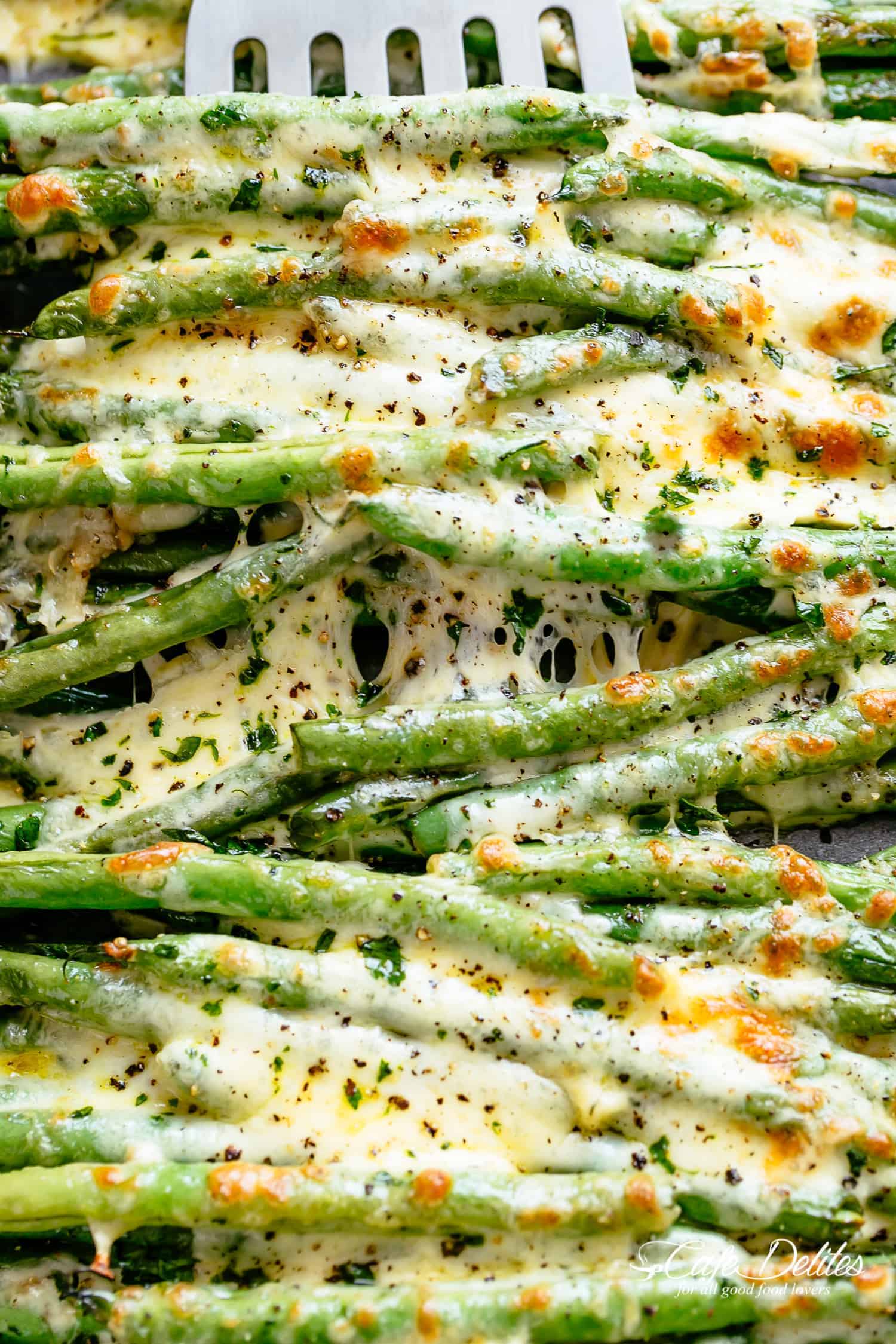 Melted cheese on roasted green beans