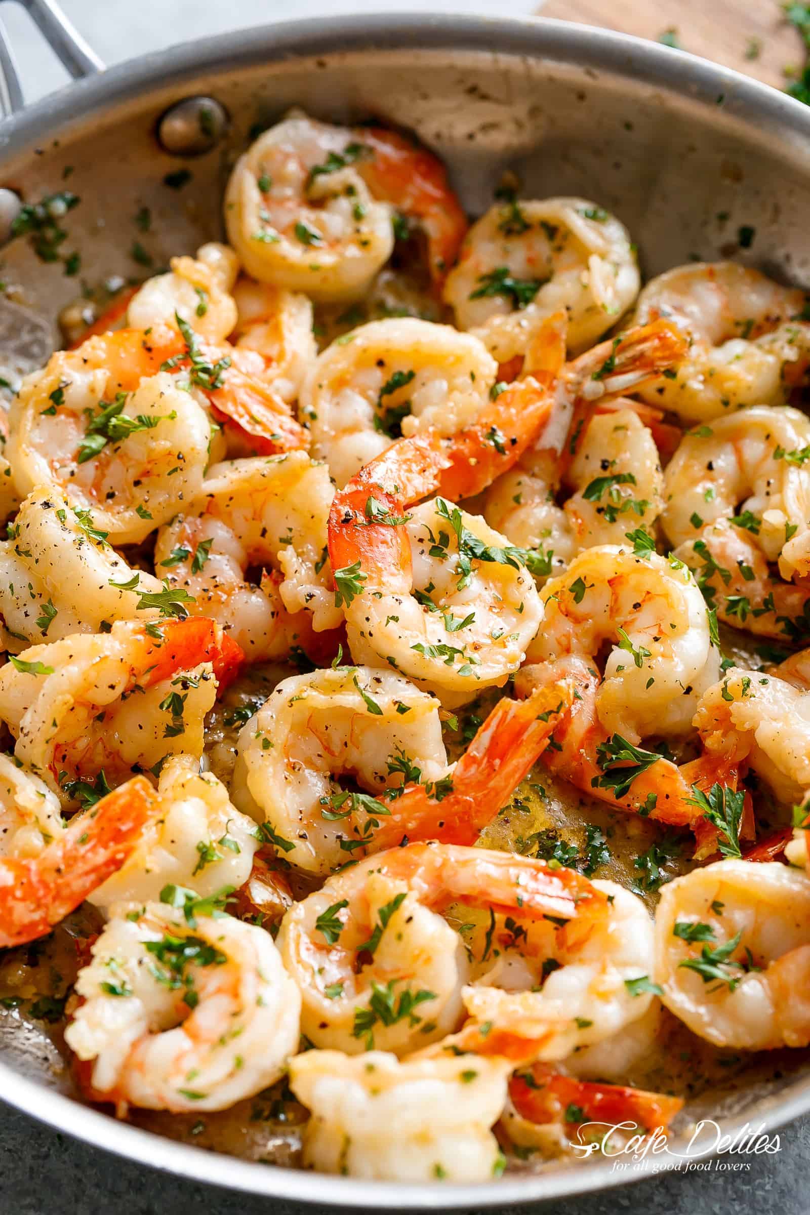 Garlic Butter Shrimp Scampi is so quick and easy! A garlic buttery scampi sauce with a hint of white wine & lemon in less than 10 minutes! Serve as an appetizer/light meal OR for dinner with pasta! Keep it low carb and serve it over zucchini noodles or with steamed cauliflower! | cafedelites.com