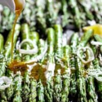 Garlic Browned Butter Baked Asparagus with Parmesan Cheese would have to be the perfect accompaniment or side dish! A delicious way to eat greens! | https://cafedelites.com