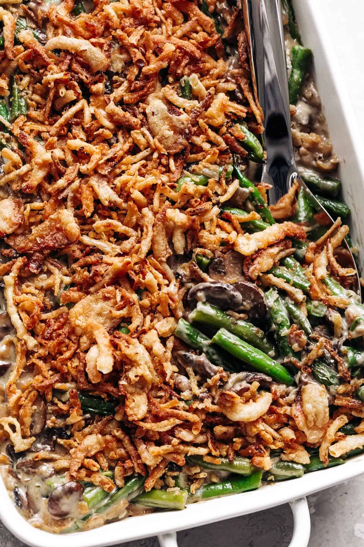 A ladle of green bean casserole fresh out of the oven!