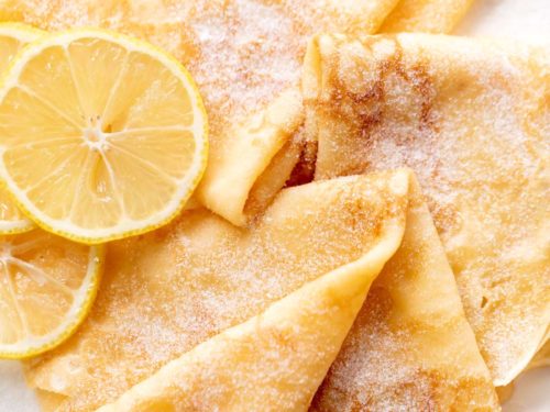 3 crepes with lemon slices and caster sugar | cafedelites.com