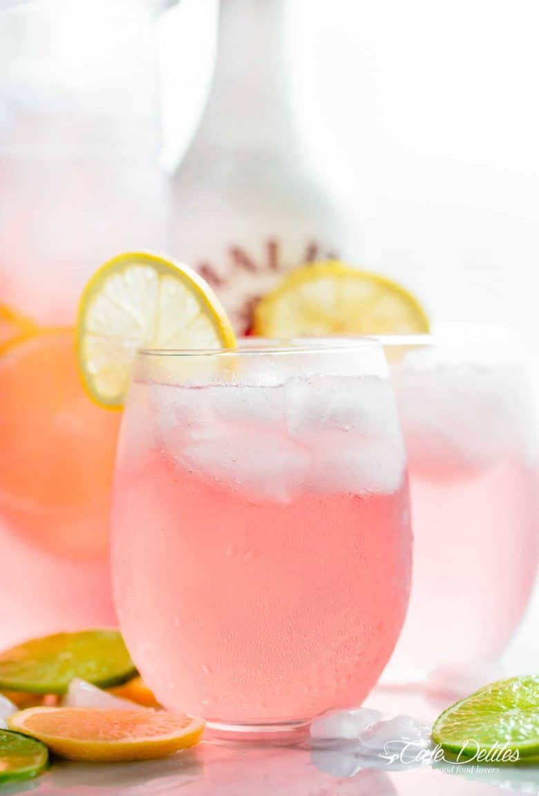 Pink Vodka Lemonade with a splash of Malibu and lime juice to get your party started! Easy to make and refreshing! | cafedelites.com