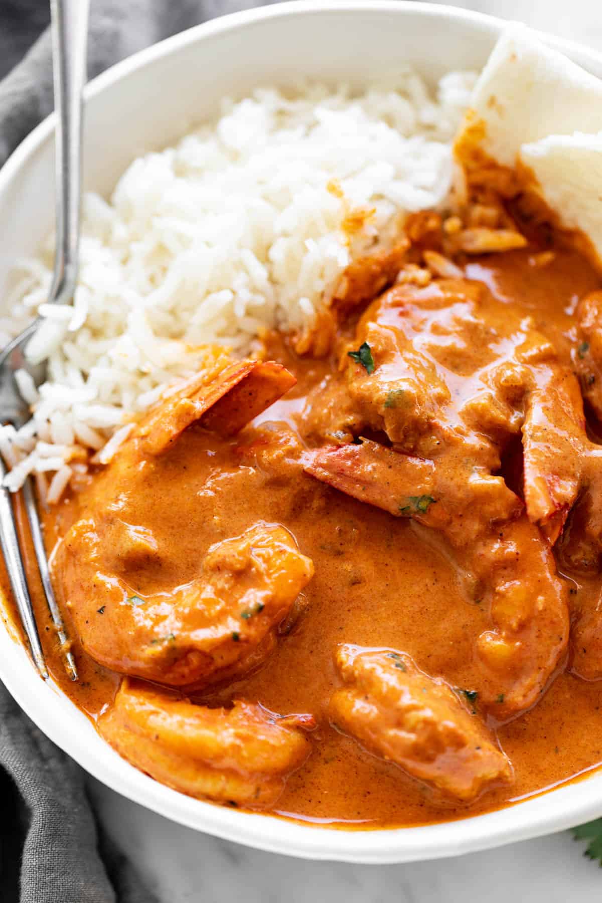 Shrimp curry served with rice and naan bread | cafedelites.com