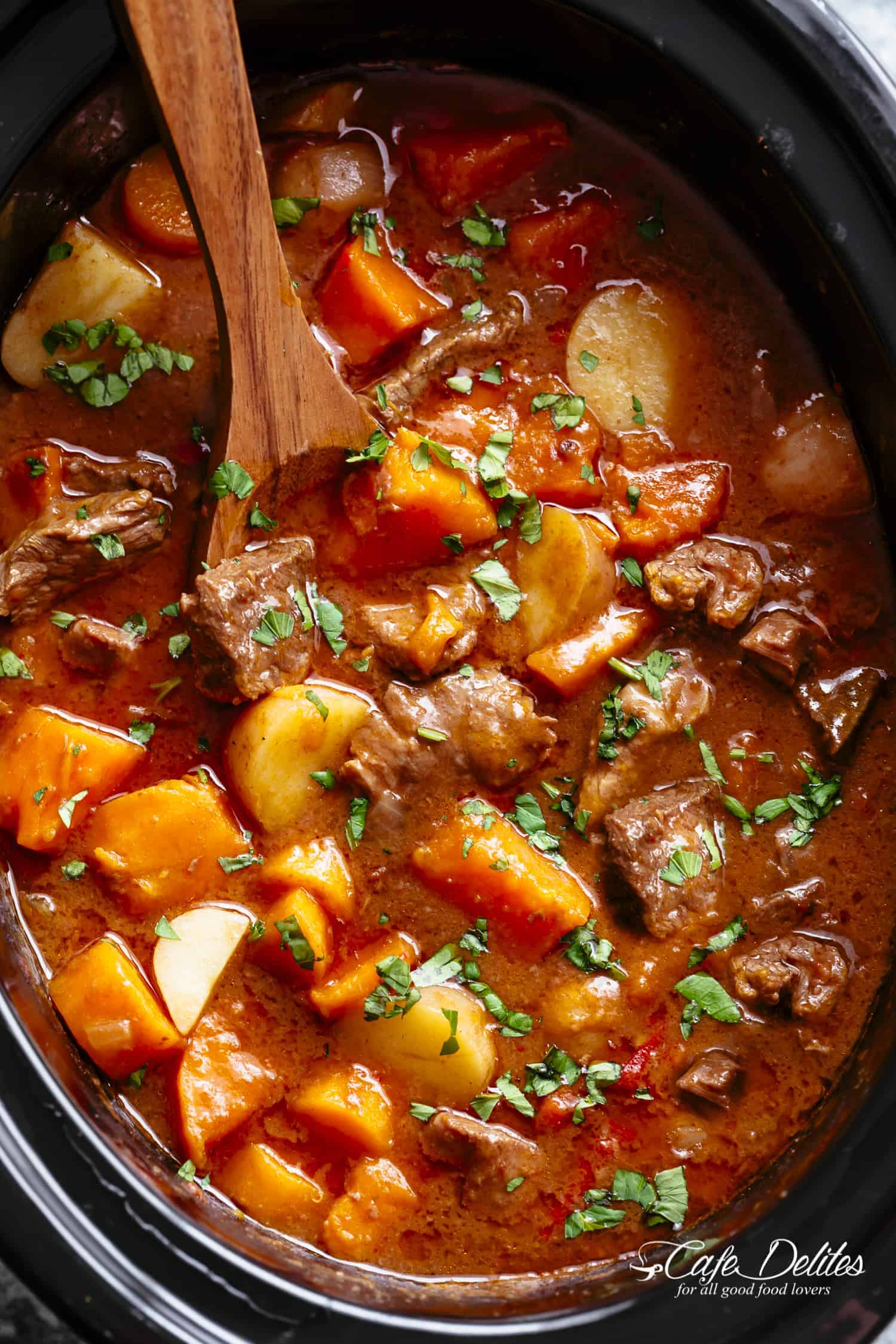 Slow Cooker Beef Stew is easy to throw together and filled with fall apart, tender beef pieces and sweet potato! | https://cafedelites.com