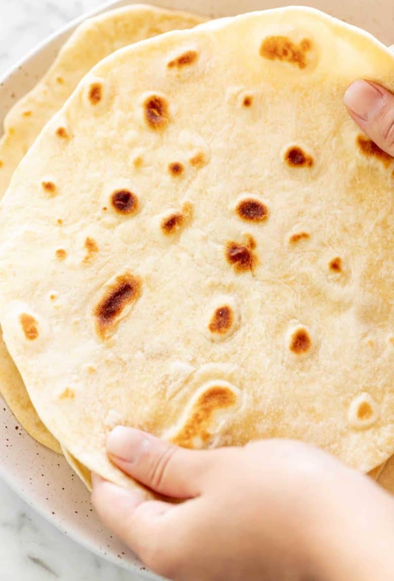 Holding a Flour Tortilla to show size | cafedelites.com